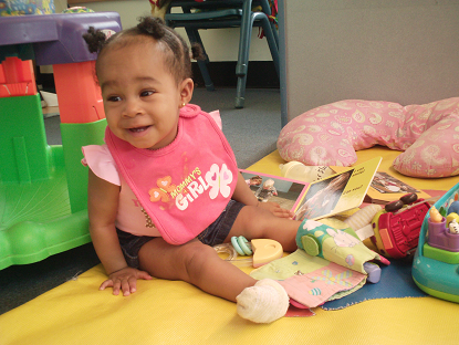 Infant (Aiden) playing with books. Infant (Aiden) playing with books.
