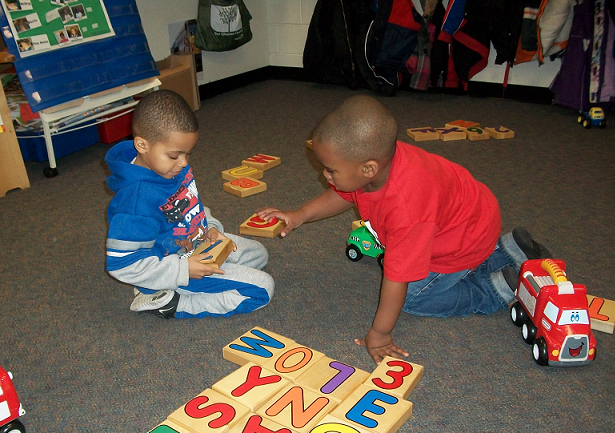 Boys playing with blocks and trucks. Alexavier (left) and Jason (right). Boys playing with blocks and trucks. Alexavier (left) and Jason (right).