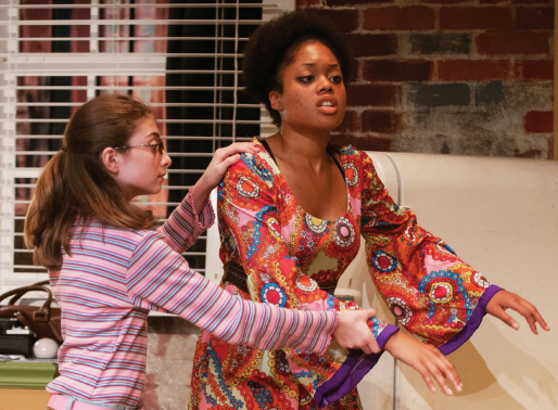 wd1 Susy’s young neighbor Gloria (Victoria Eriavez) guides her through her apartment.