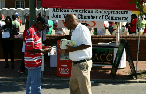 Brian Taylor with the Central Virginia African American Chamber of  Commerce worked the crowd, introducing as many people as possible to  the new chamber.