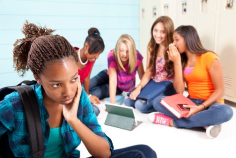 Teens using internet technology and harassing classmate