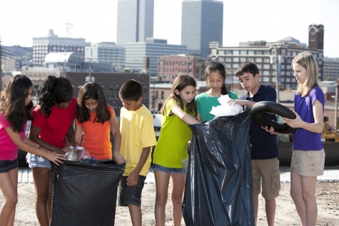 Go Green: Ethnically Diverse Children Clean Tash from Urban Area